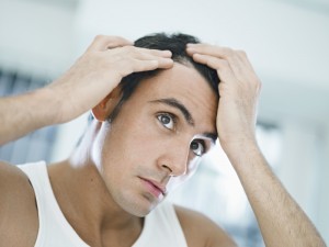 man-checking-his-hair